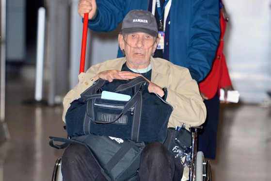 Leonard Nimoy rolls through JFK Airport in Wheelchair with Oxygen Pump